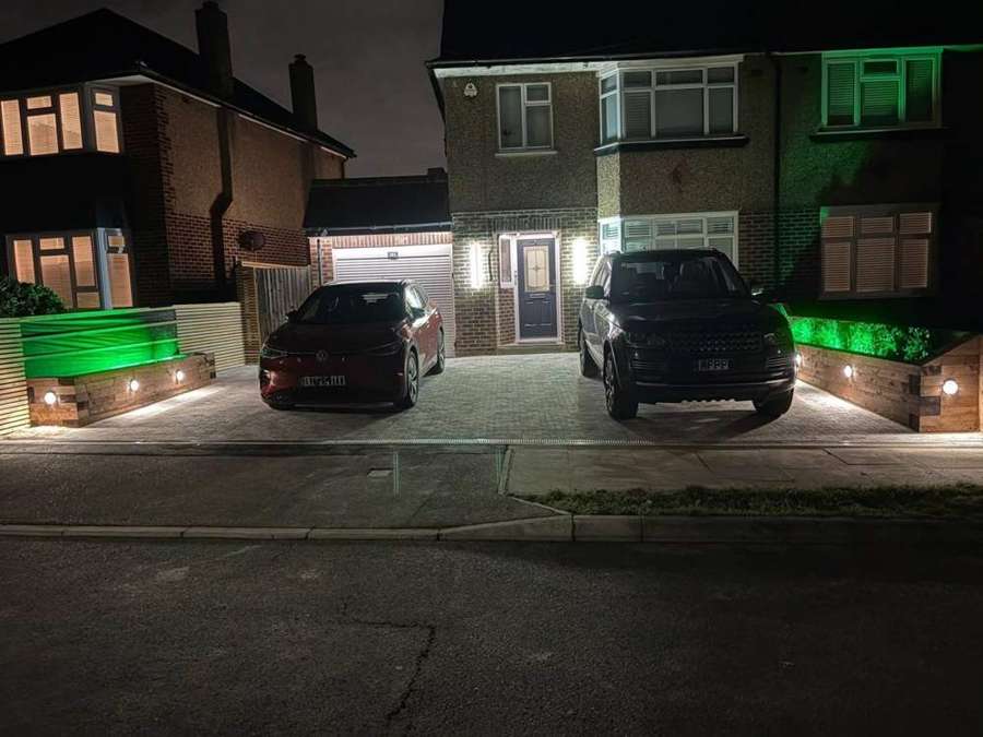 Block driveway with sleeper planters