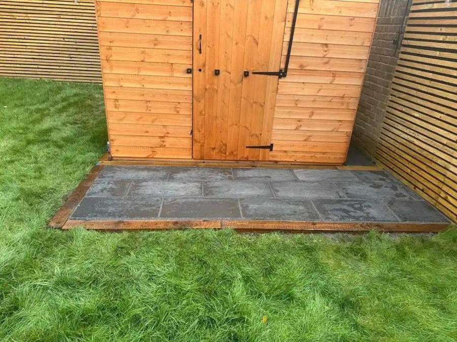 Slate paved base edged in timber