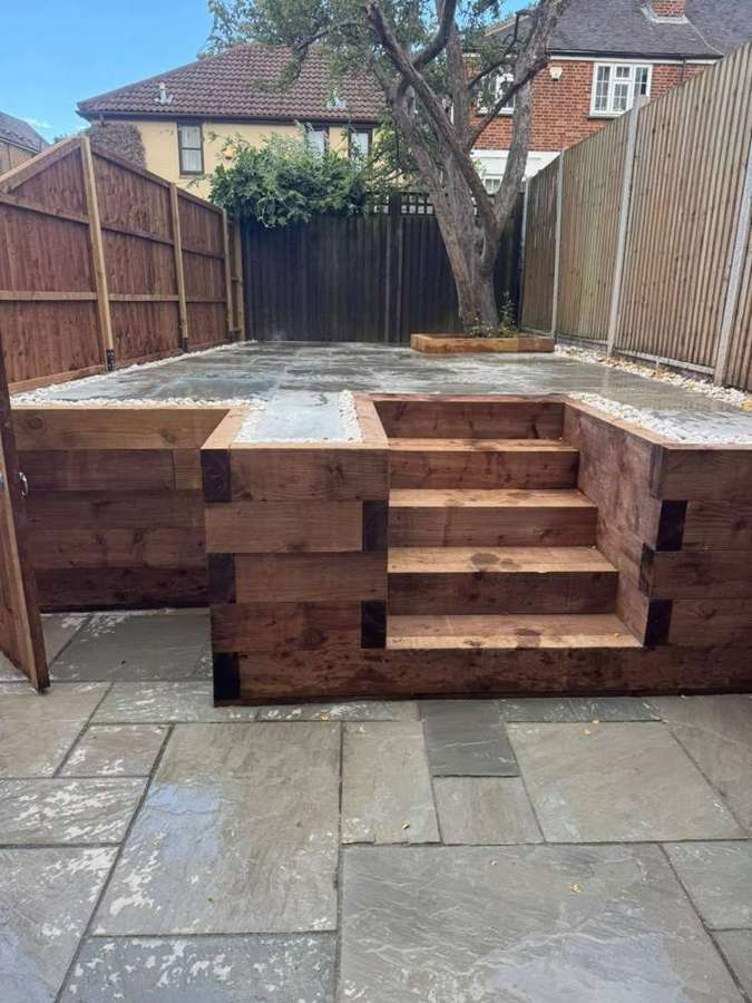 Raised sleeper terrace with sandstone paving
